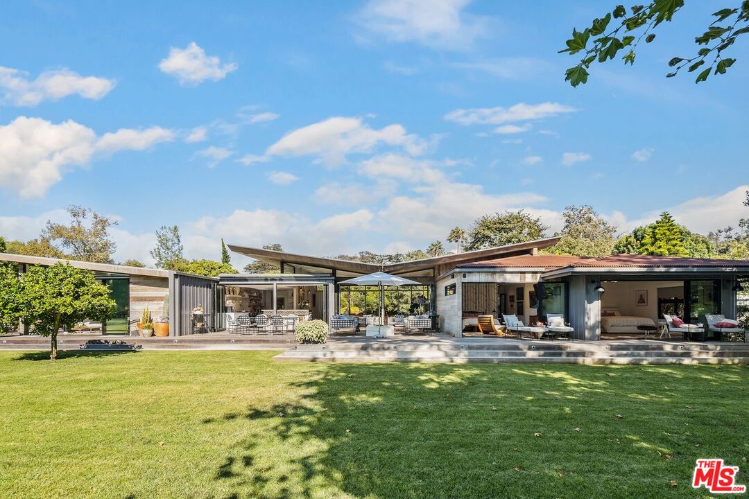 6237 Bonsall Drive Malibu, CA 90265 - Photo 38 of 50 a swimming pool view with a seating space and a garden