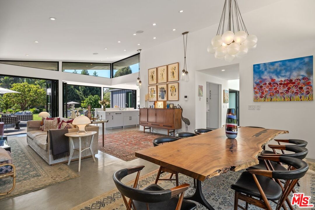 6237 Bonsall Drive Malibu, CA 90265 - Photo 5 of 50 a view of a dining room with furniture window and outside view
