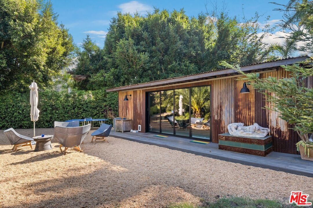 6237 Bonsall Drive Malibu, CA 90265 - Photo 45 of 50 a backyard of a house with garden view and a patio