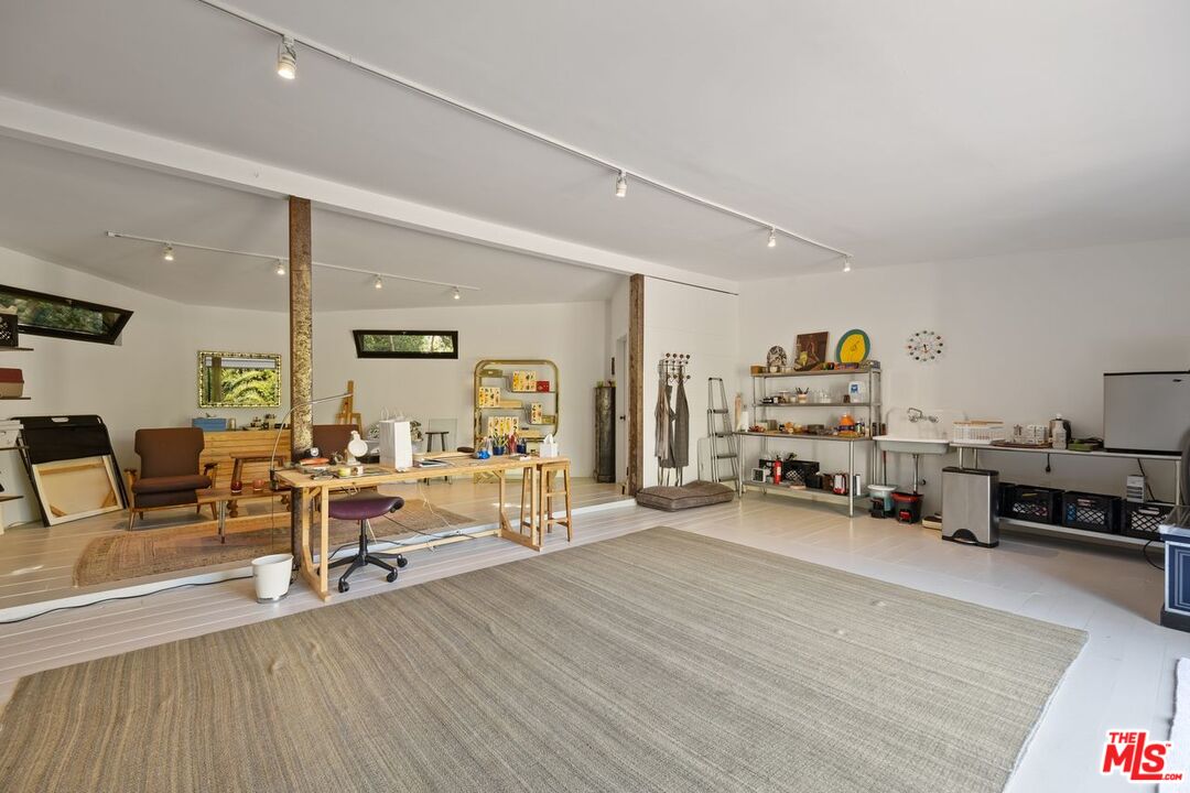 6237 Bonsall Drive Malibu, CA 90265 - Photo 46 of 50 a living room with furniture and a wooden floor