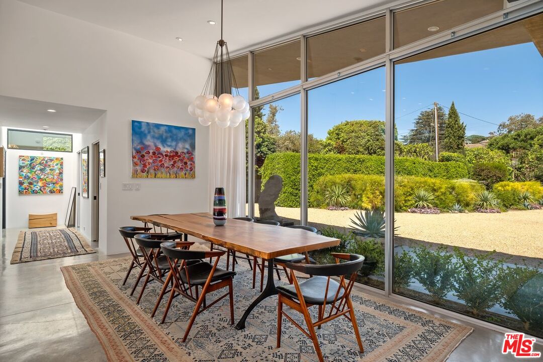 6237 Bonsall Drive Malibu, CA 90265 - Photo 7 of 50 a view of a dining room with furniture window and wooden floor
