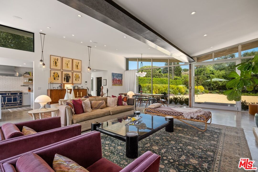 6237 Bonsall Drive Malibu, CA 90265 - Photo 9 of 50 a living room with lots of furniture and a large window