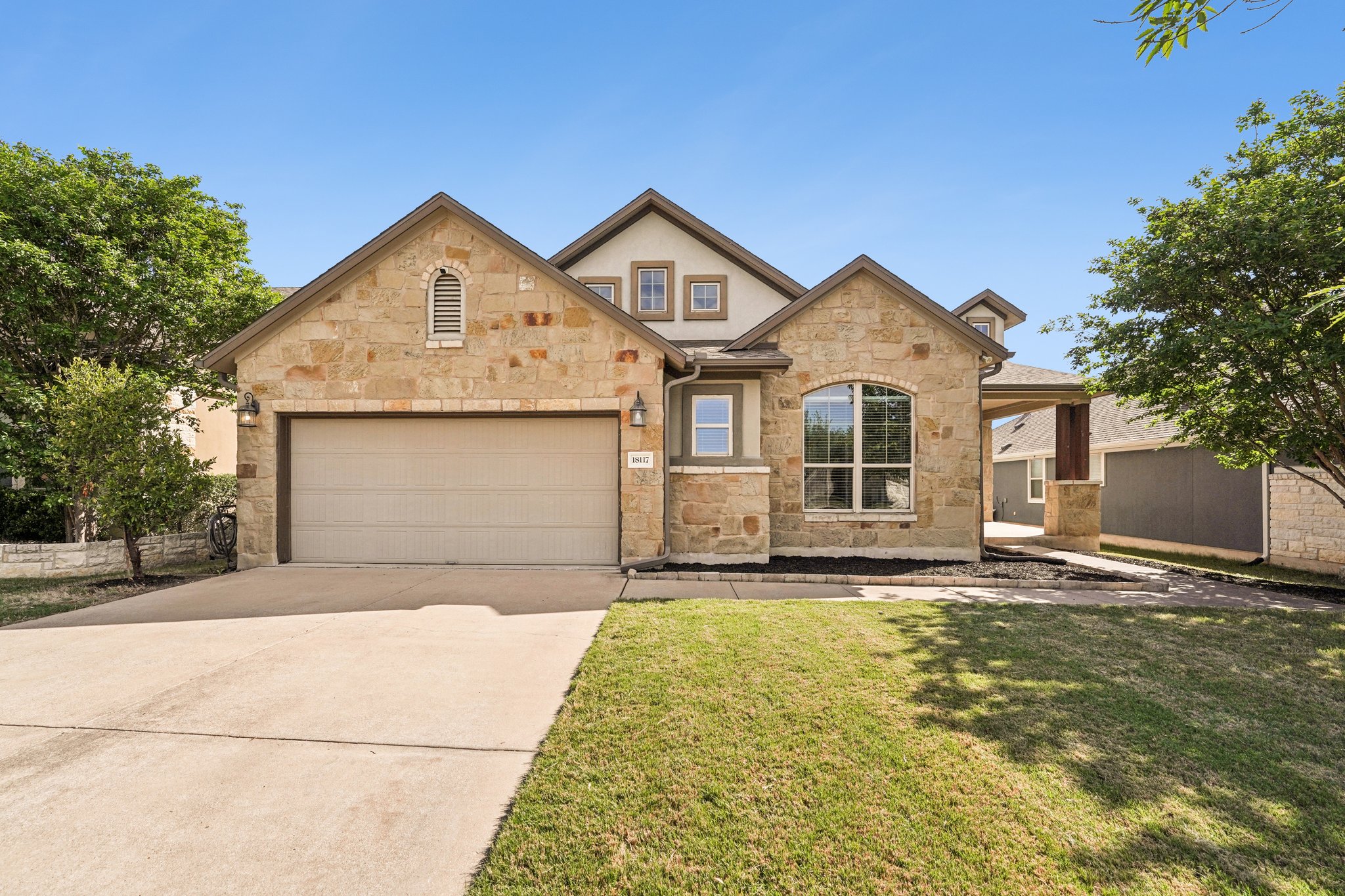 18117 Monarch Butterfly Way Pflugerville, TX 78660 - Photo 1 of 19 A welcoming façade reflects the care and quality found throughout the home.