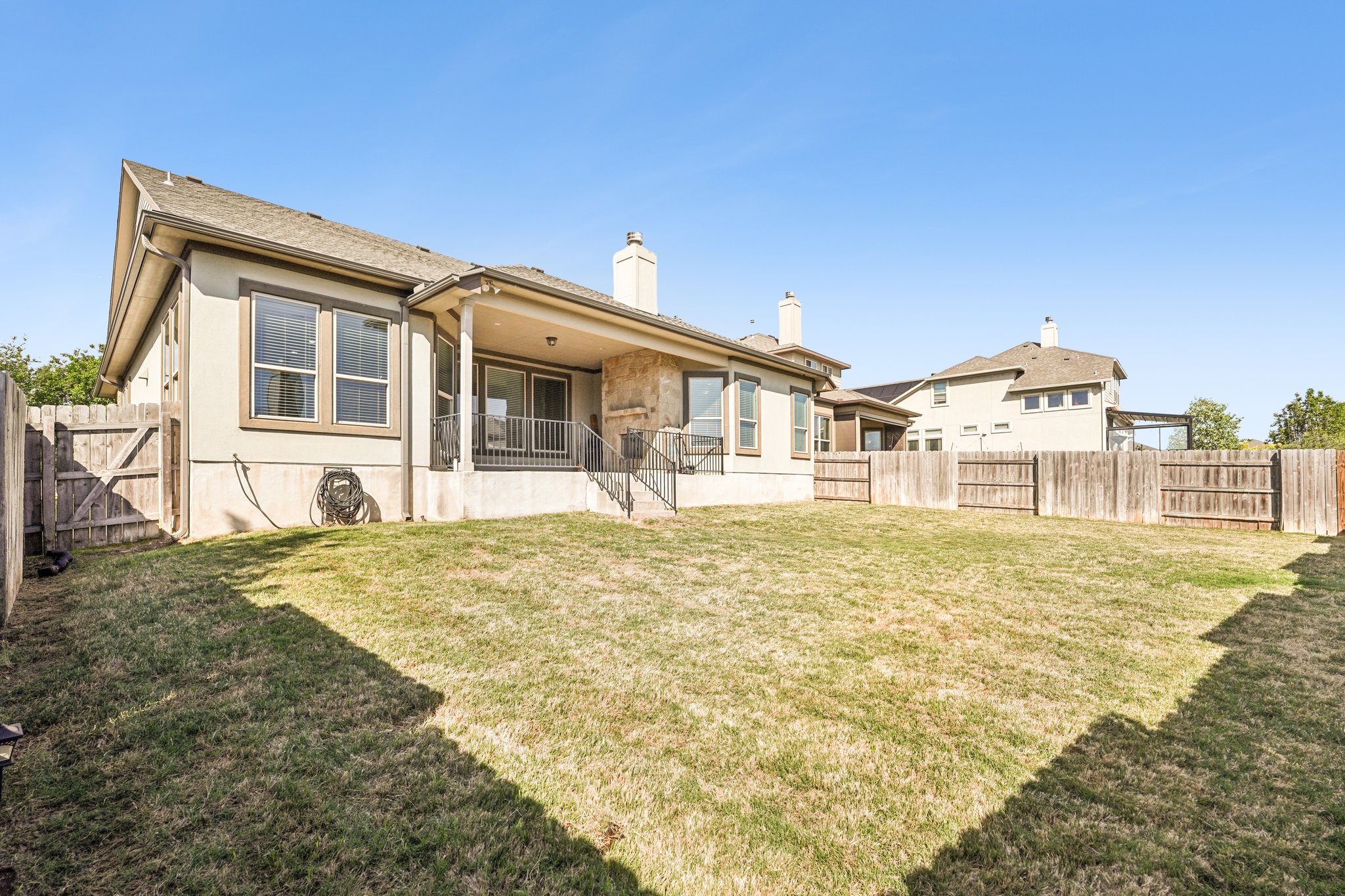18117 Monarch Butterfly Way Pflugerville, TX 78660 - Photo 16 of 19 A fully fenced backyard offers privacy and space for outdoor enjoyment.