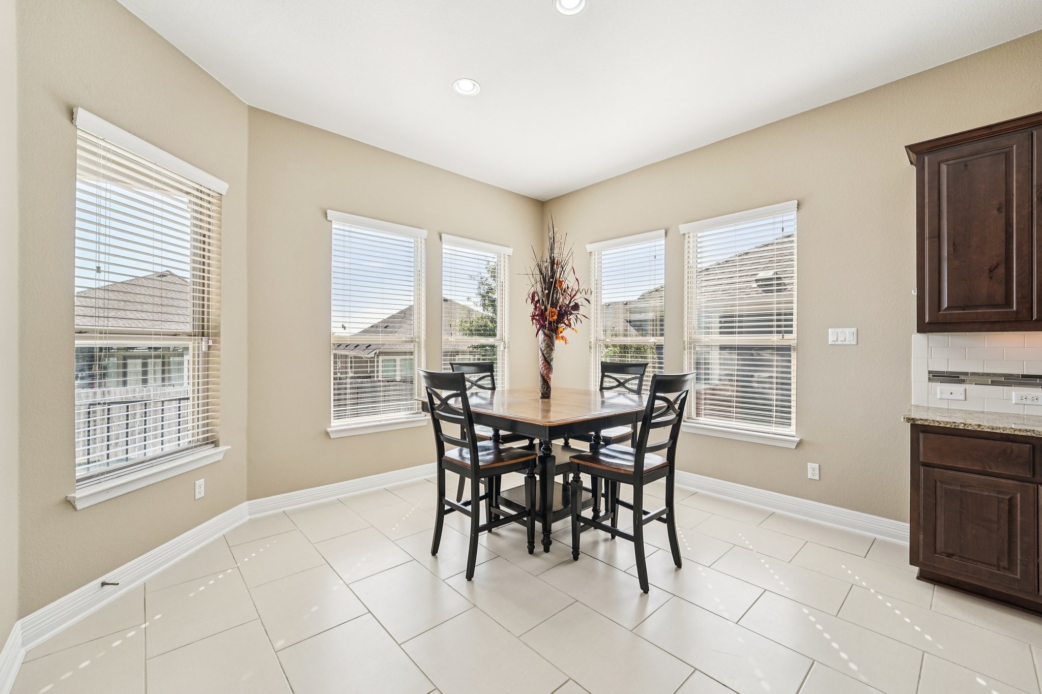 18117 Monarch Butterfly Way Pflugerville, TX 78660 - Photo 3 of 19 Natural light enhances the dining area, creating a warm and inviting setting.