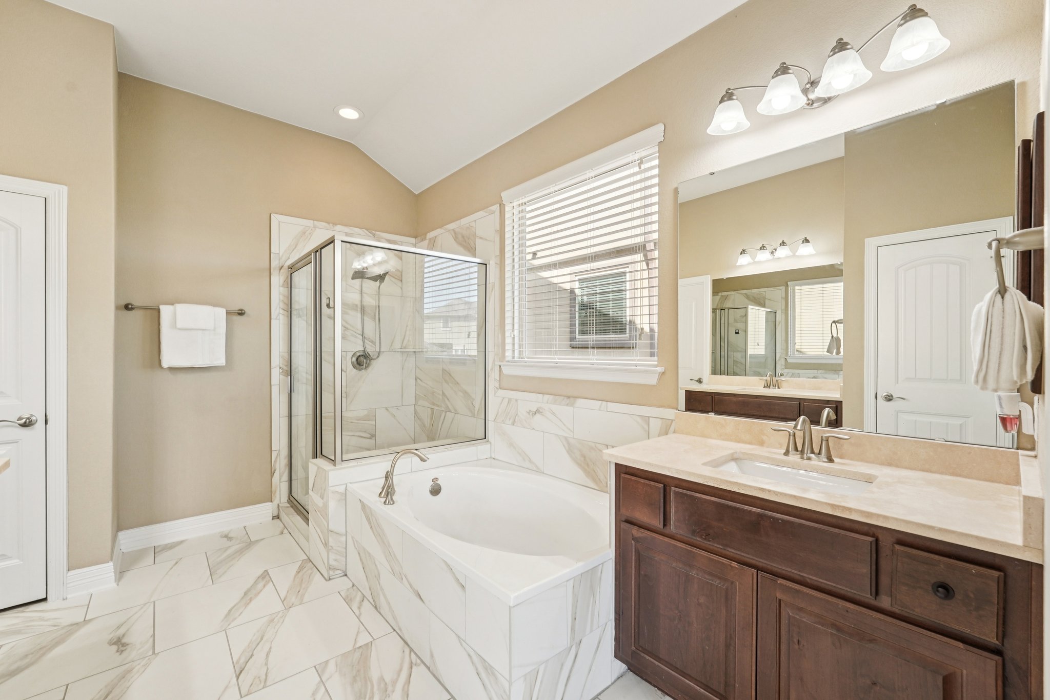 18117 Monarch Butterfly Way Pflugerville, TX 78660 - Photo 9 of 19 An oversized soaking tub invites relaxation after a long day.