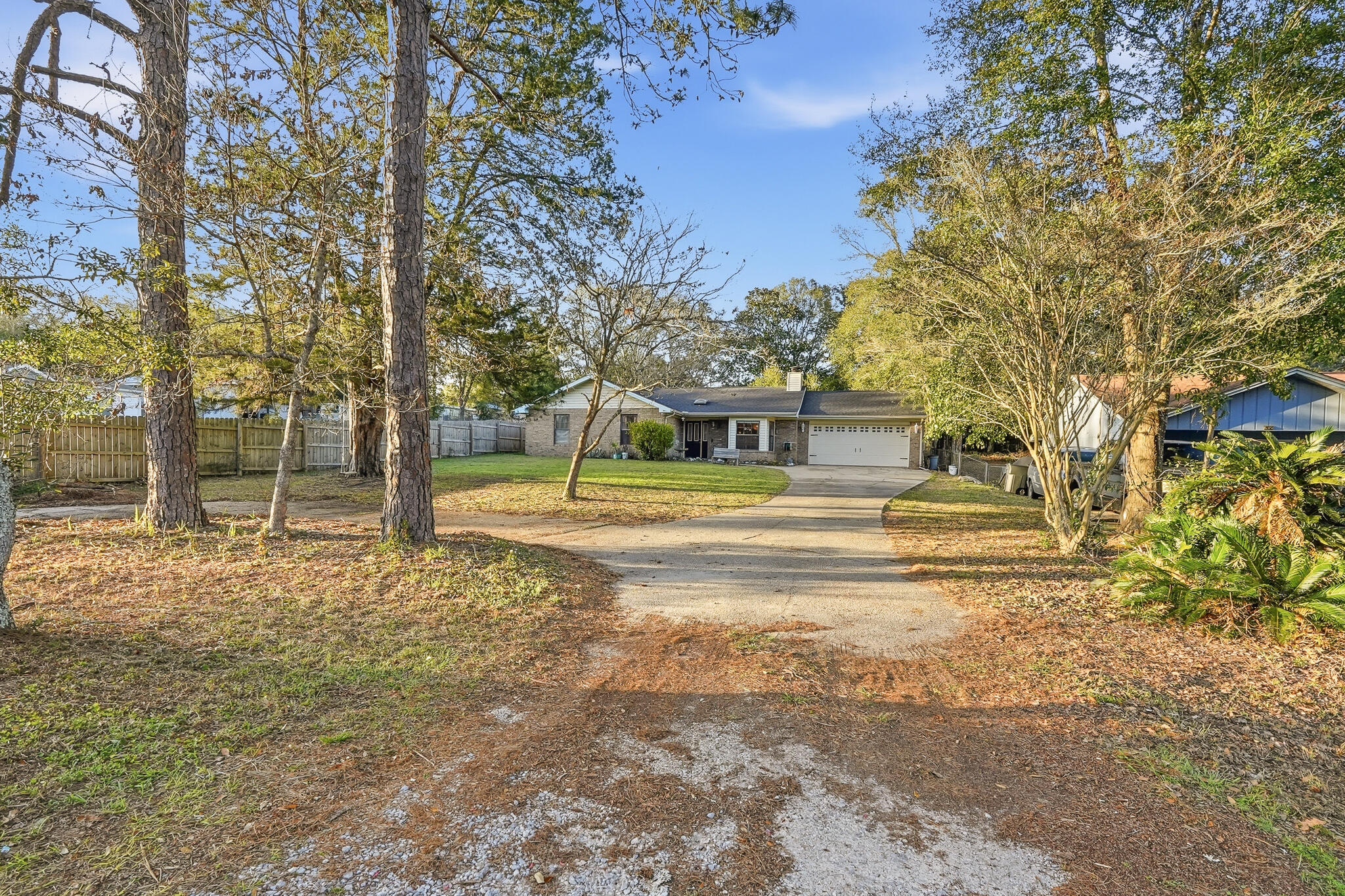 271 Willow Avenue Freeport, FL 32439 - Photo 14 of 57 a swimming pool view with a trees in the background