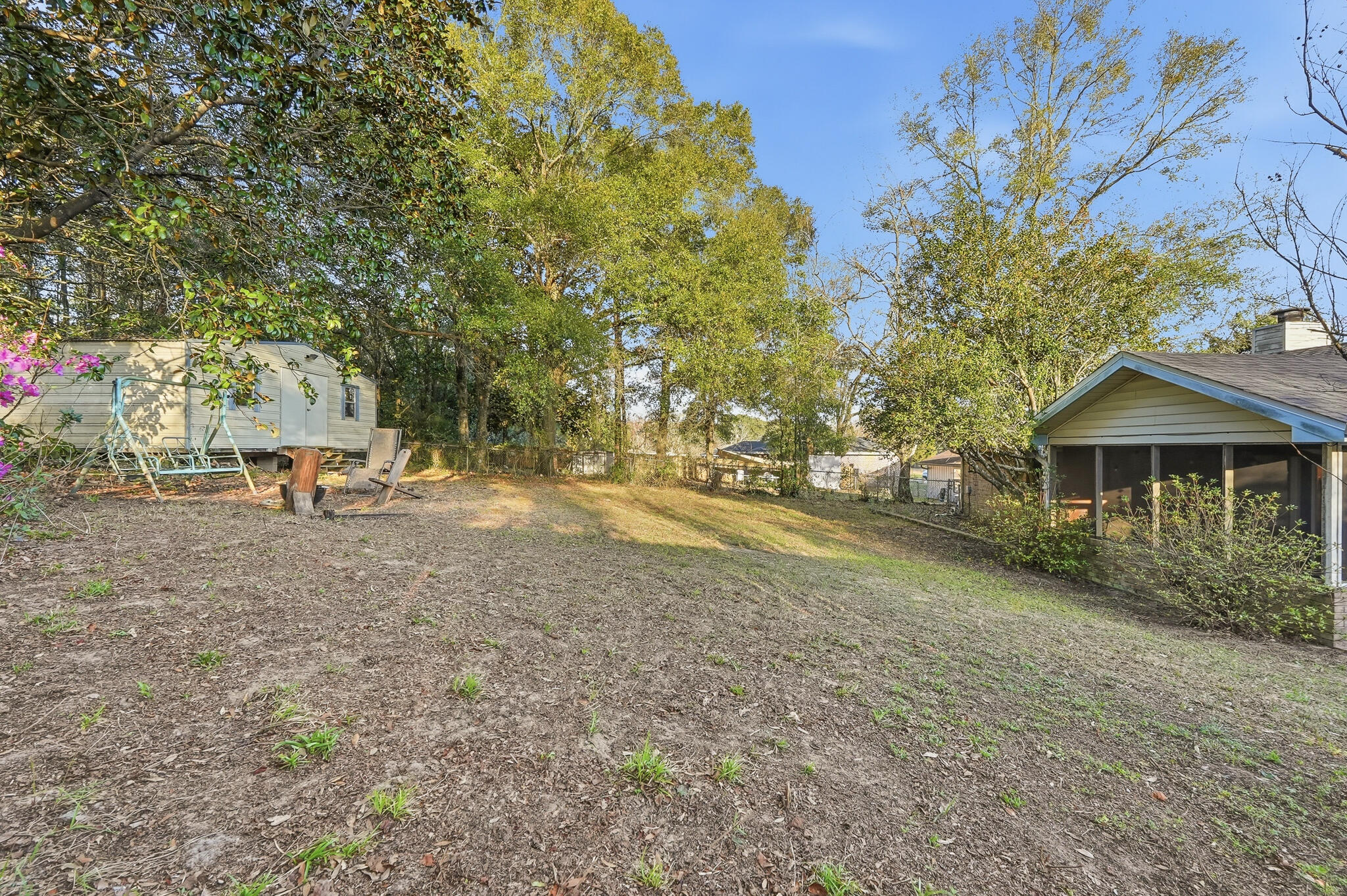 271 Willow Avenue Freeport, FL 32439 - Photo 20 of 57 a backyard of a house with table and chairs