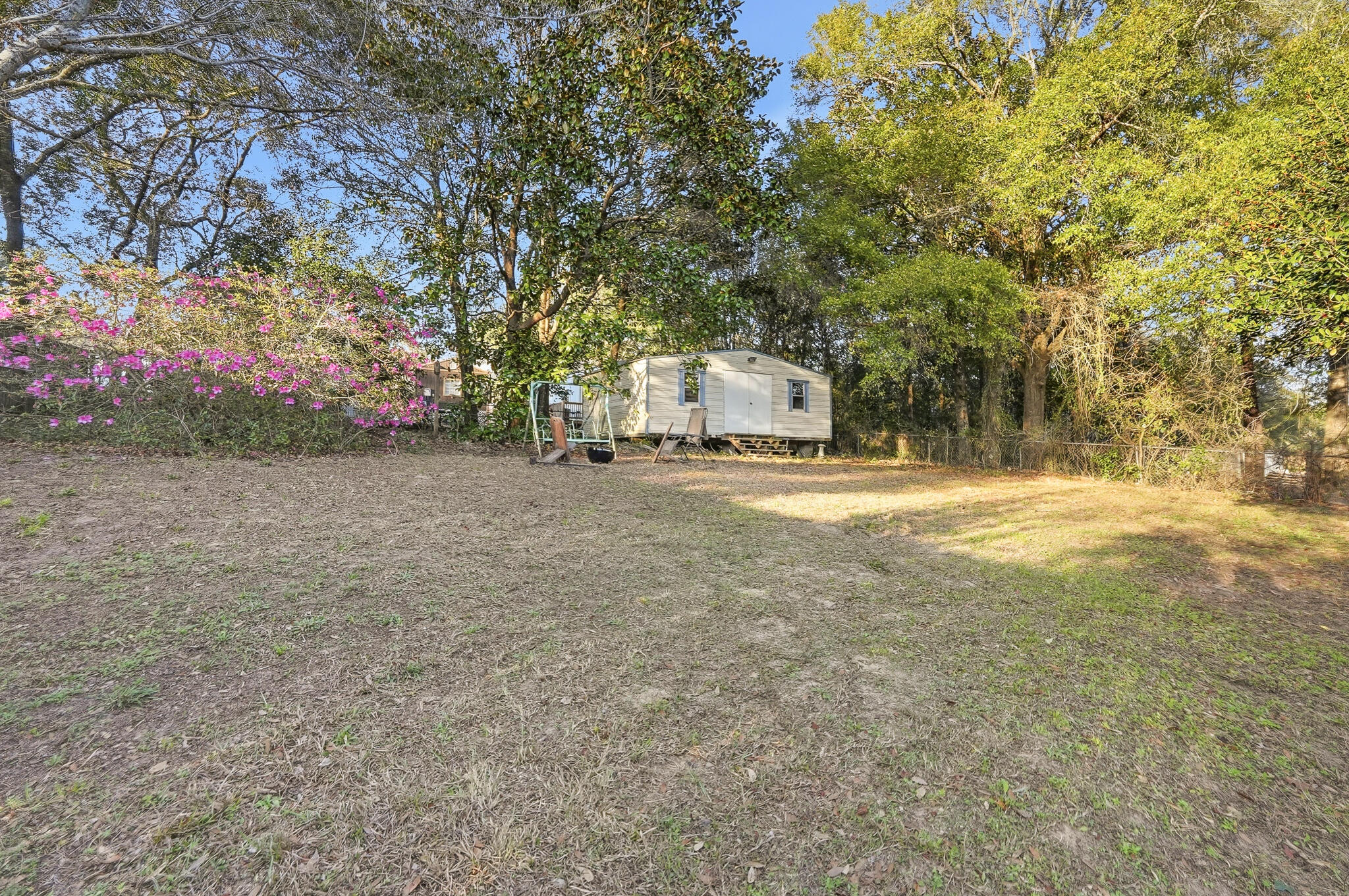271 Willow Avenue Freeport, FL 32439 - Photo 25 of 57 a view of yard with tree and wooden fence