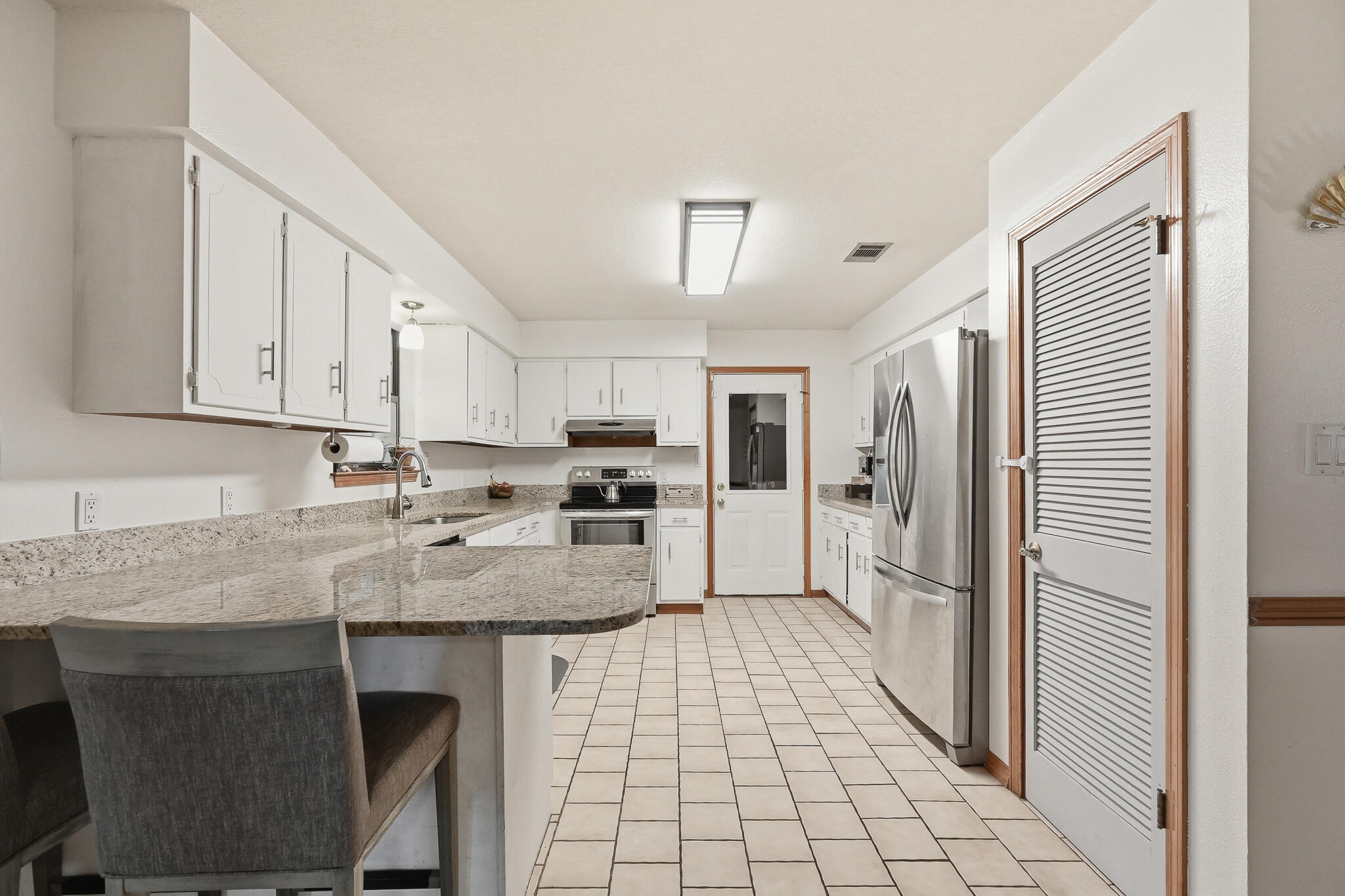 271 Willow Avenue Freeport, FL 32439 - Photo 31 of 57 a kitchen with stainless steel appliances granite countertop a sink and cabinets