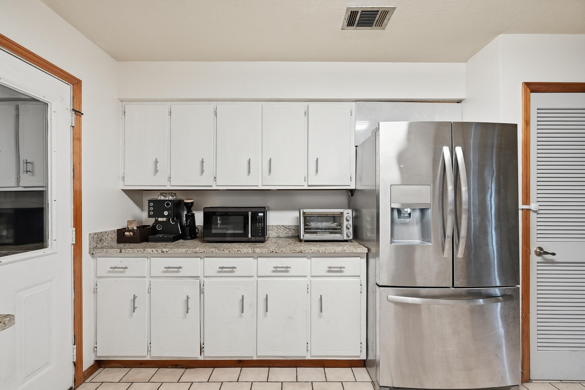 271 Willow Avenue Freeport, FL 32439 - Photo 33 of 57 a kitchen with stainless steel appliances granite countertop a refrigerator sink and cabinets