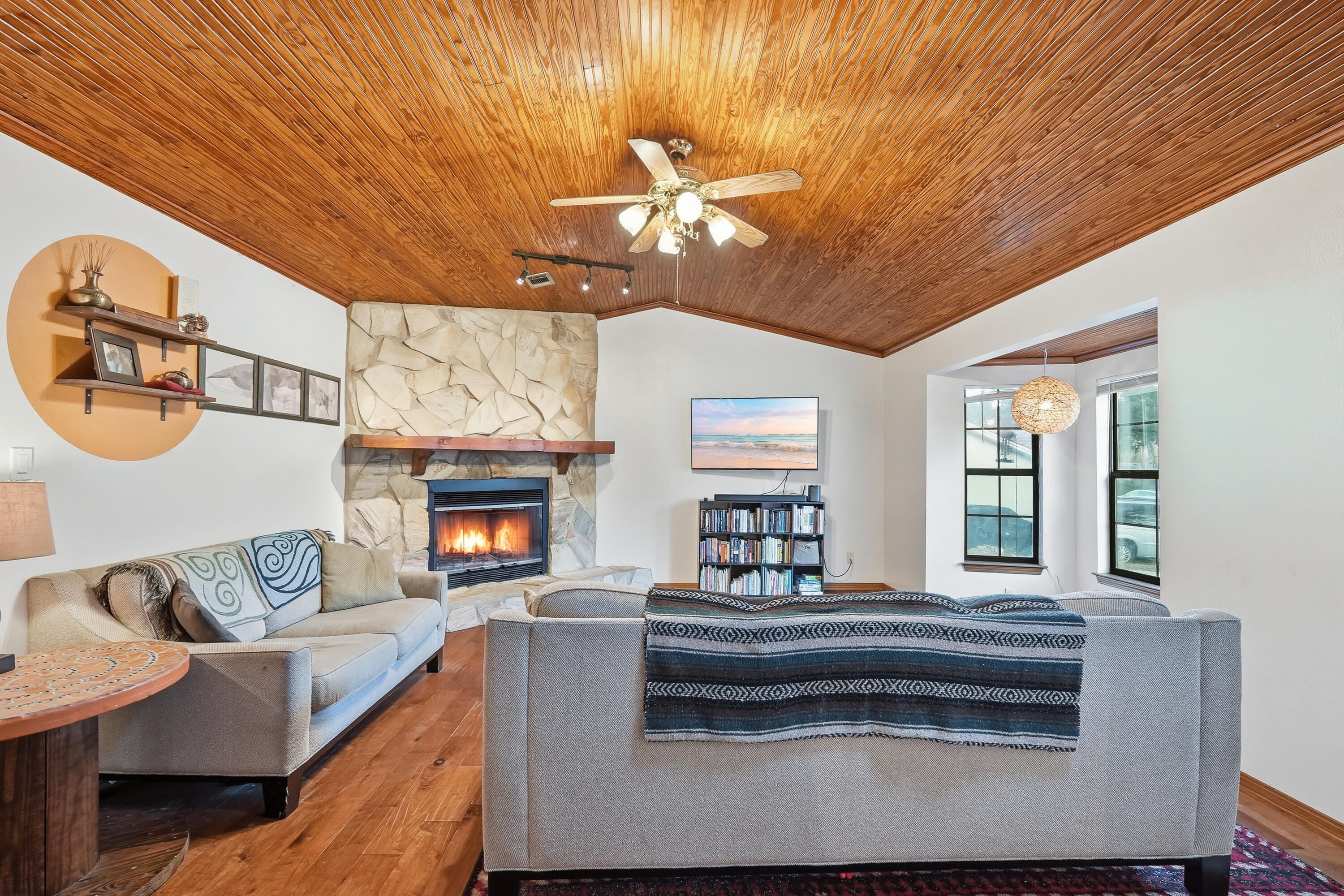 271 Willow Avenue Freeport, FL 32439 - Photo 44 of 57 a living room with furniture a fireplace and a chandelier