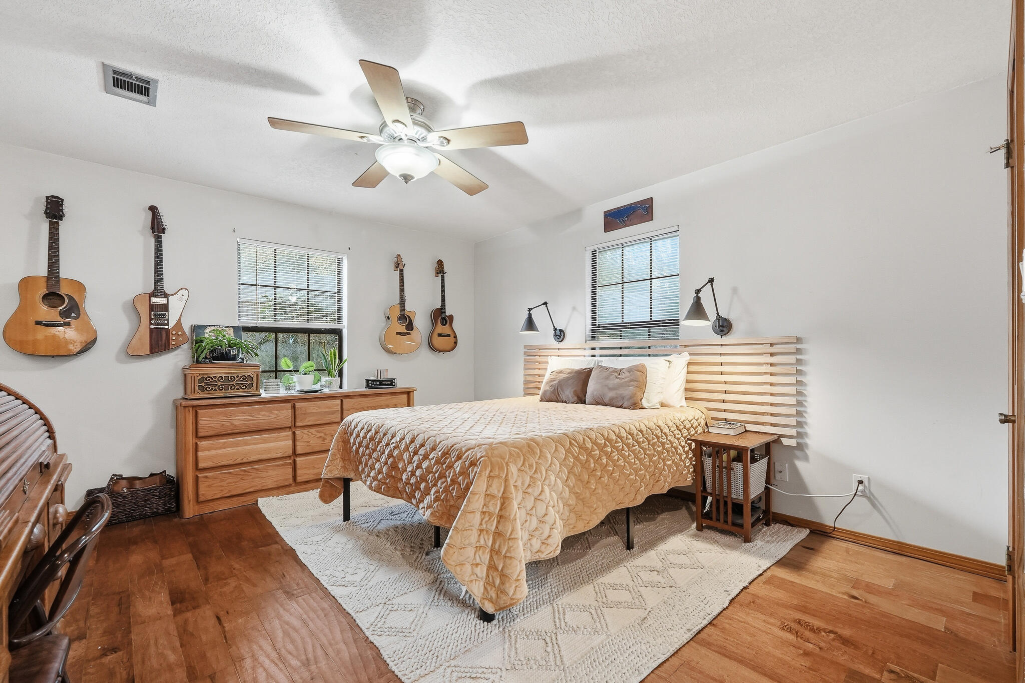 271 Willow Avenue Freeport, FL 32439 - Photo 48 of 57 a bedroom with a bed and a chandelier