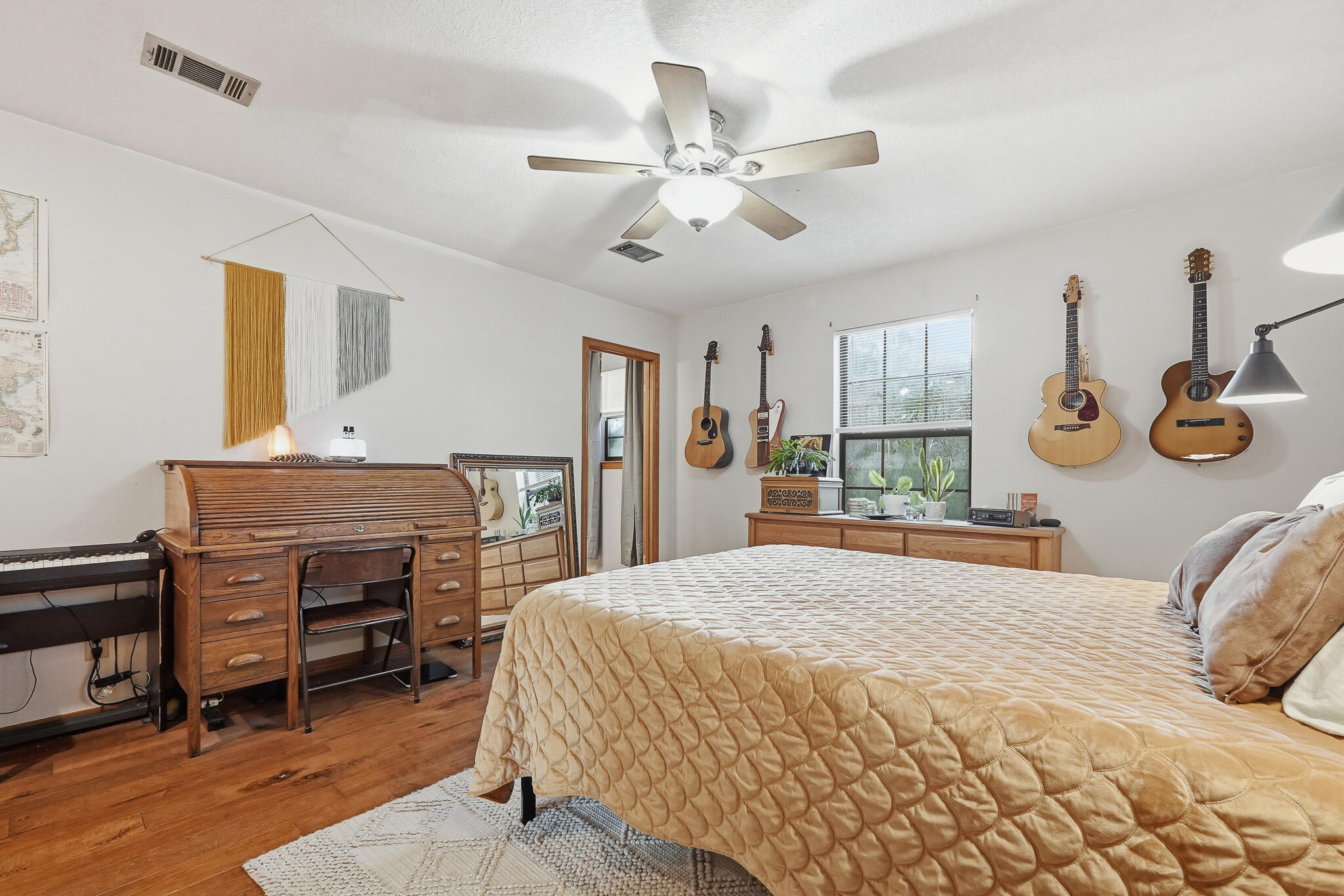 271 Willow Avenue Freeport, FL 32439 - Photo 49 of 57 a bedroom with a bed and a chandelier