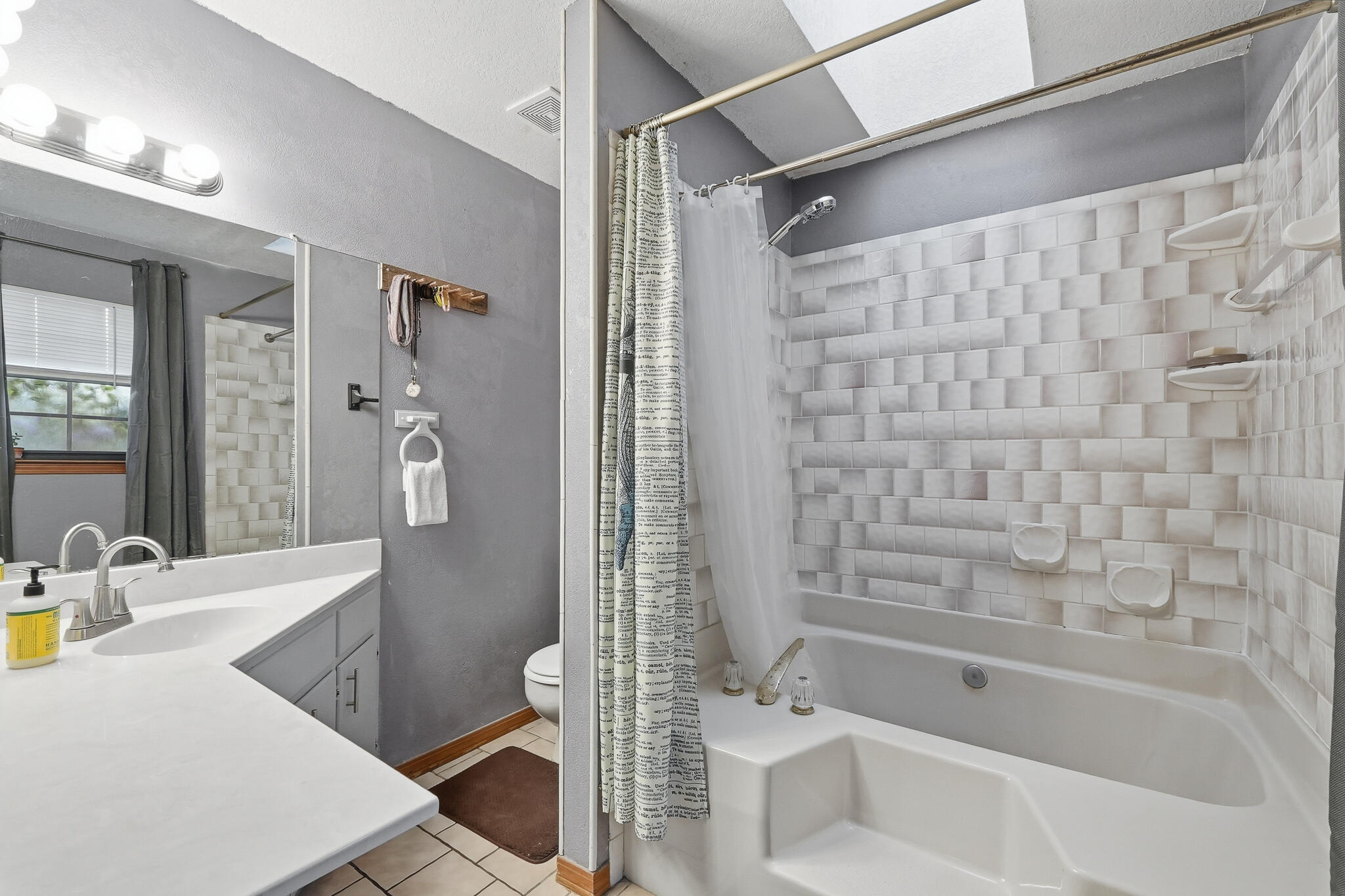 271 Willow Avenue Freeport, FL 32439 - Photo 51 of 57 a bath room with a bath tub and a shower