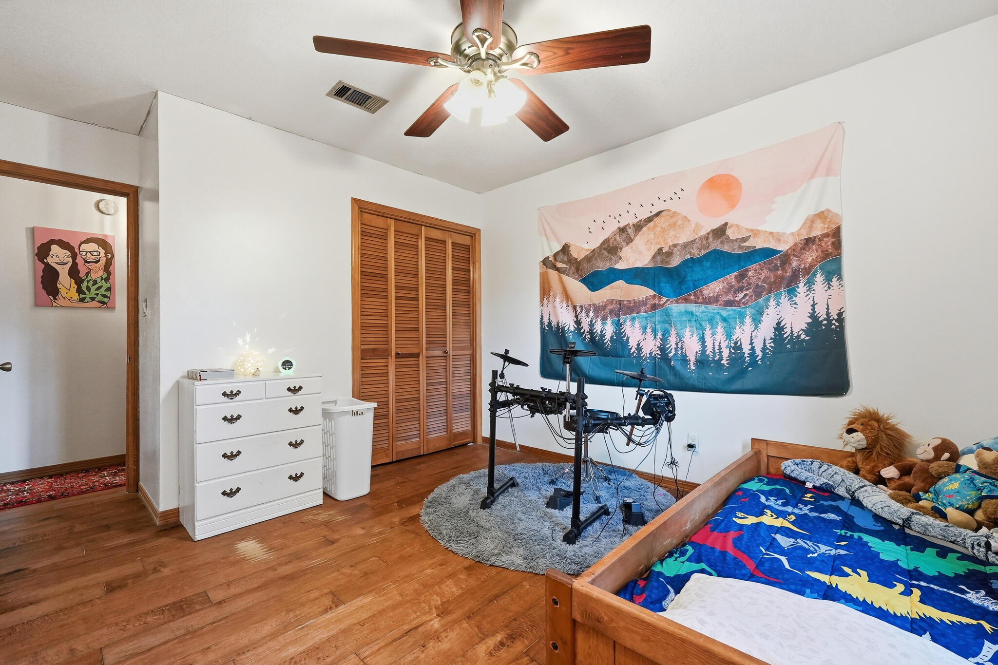 271 Willow Avenue Freeport, FL 32439 - Photo 54 of 57 a living room with furniture a chandelier and a wooden floor
