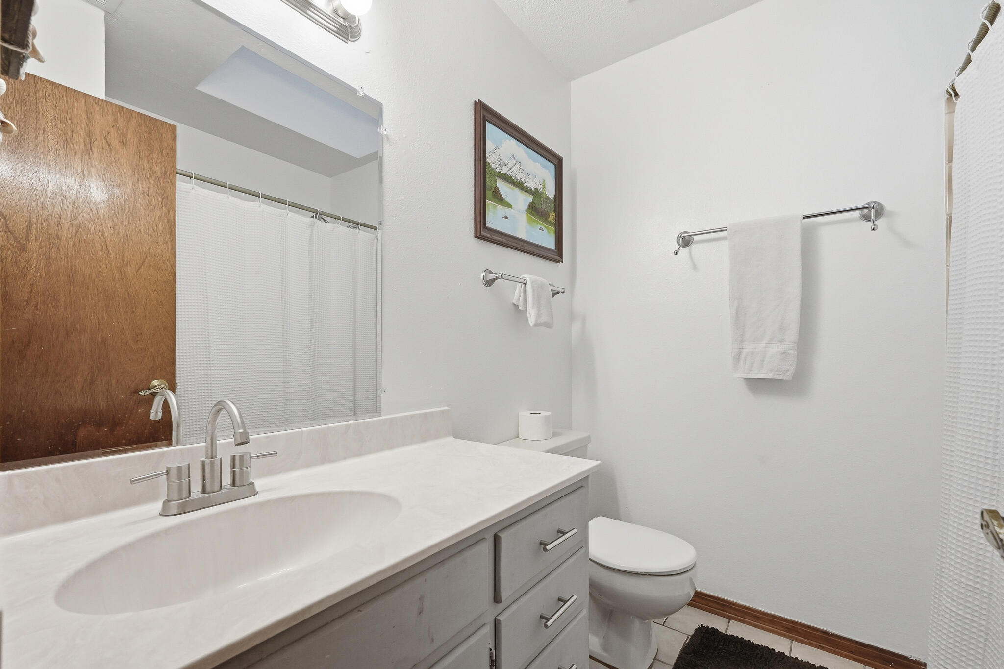 271 Willow Avenue Freeport, FL 32439 - Photo 57 of 57 a bathroom with a sink toilet and vanity