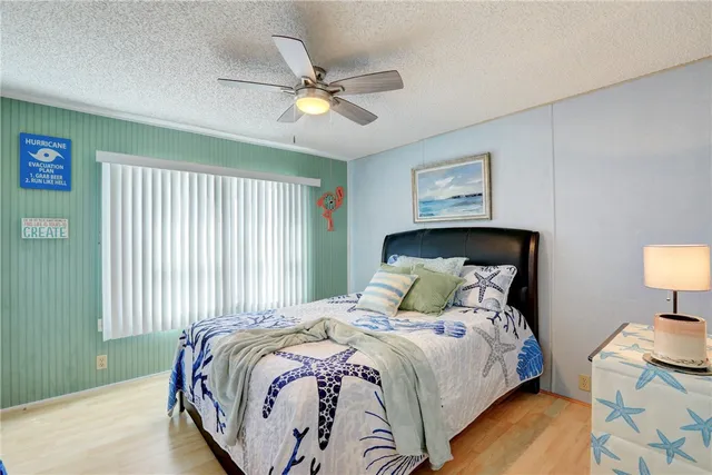 a bedroom with a bed and a lamp