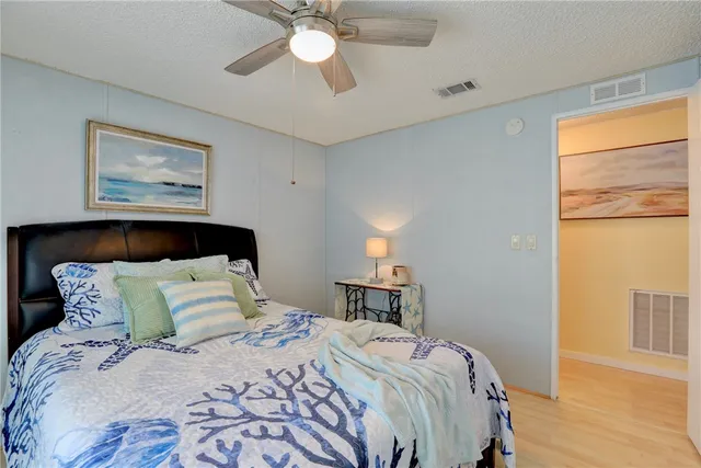 a bedroom with bed and a window