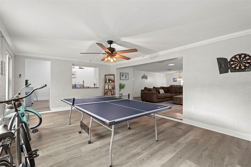 14030 79th Avenue Seminole, FL 33776 - Photo 12 of 33 a room with gym equipment and wooden floor