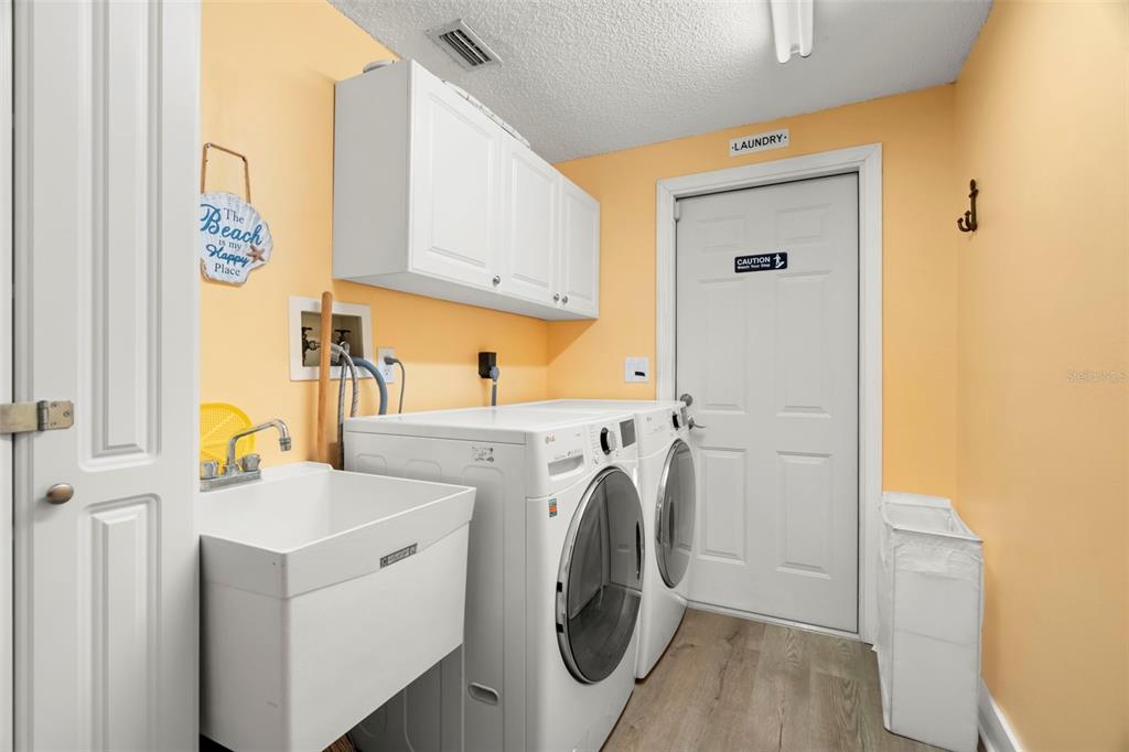 14030 79th Avenue Seminole, FL 33776 - Photo 20 of 33 a utility room with dryer and washer