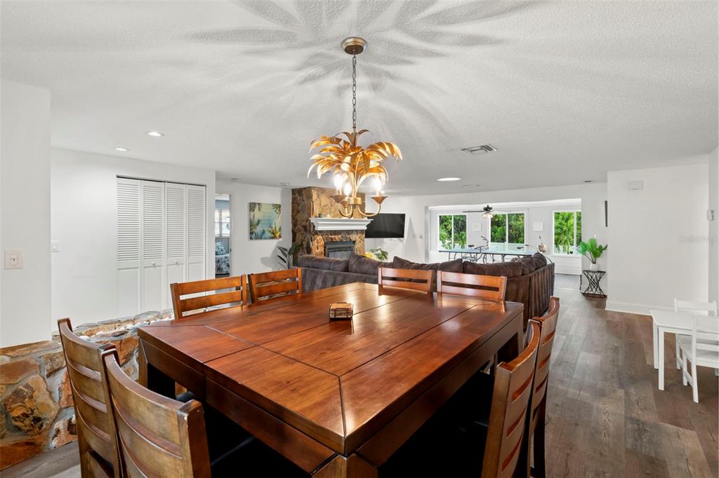 14030 79th Avenue Seminole, FL 33776 - Photo 6 of 33 a dining room with a table chairs and a kitchen view
