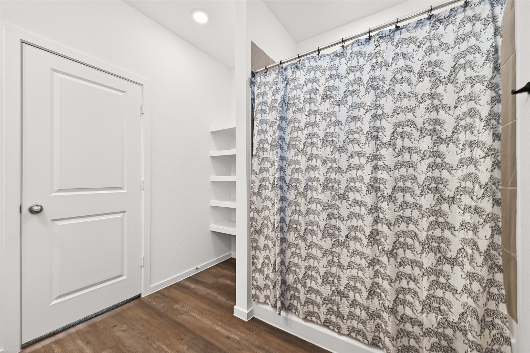 5442 Pinetree Cres Lane Spring, TX 77373 - Photo 11 of 24 The primary ensuite bath features dual sinks, walk in shower, built in storage and a generously sized walk in closet