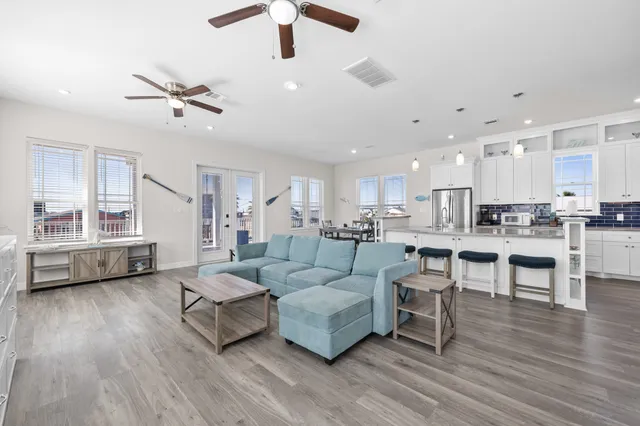 a kitchen with counter top space sink and stainless steel appliances