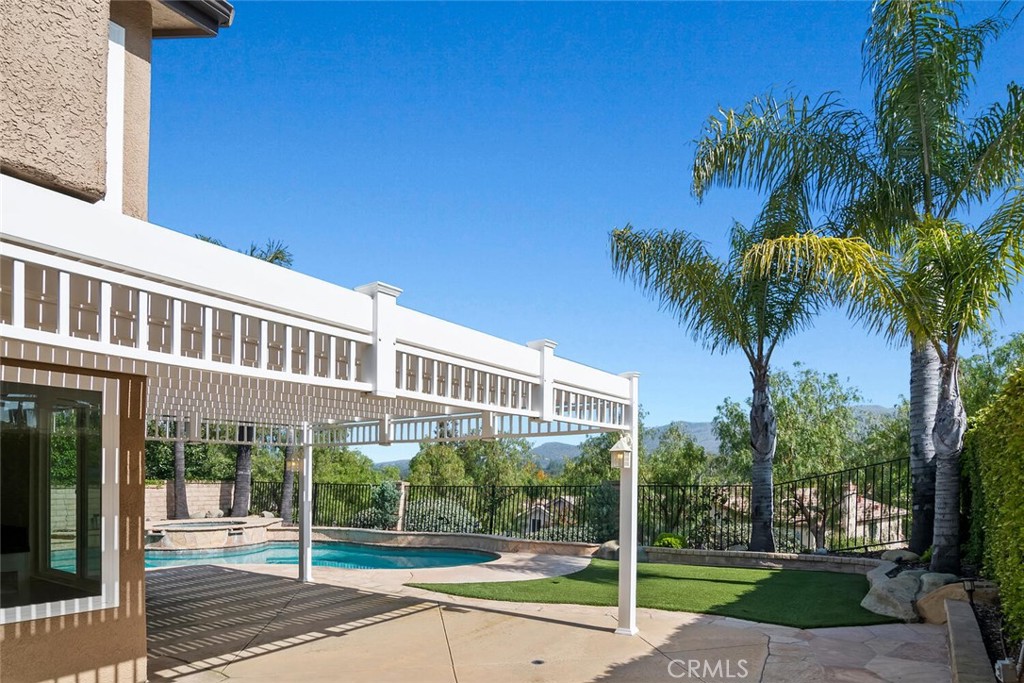 5149 Pesto Way Oak Park, CA 91377 - Photo 15 of 42 a view of a tall building with a yard