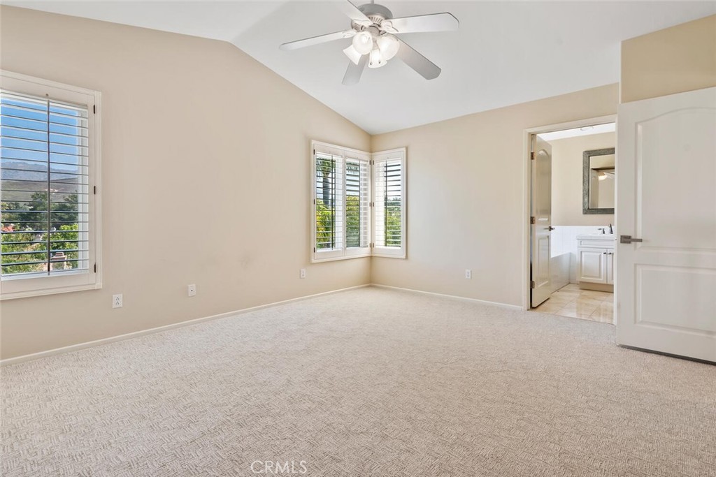 5149 Pesto Way Oak Park, CA 91377 - Photo 25 of 42 an empty room with windows and fan