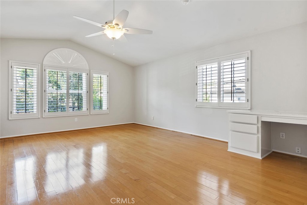5149 Pesto Way Oak Park, CA 91377 - Photo 33 of 42 an empty room with windows and ceiling fan