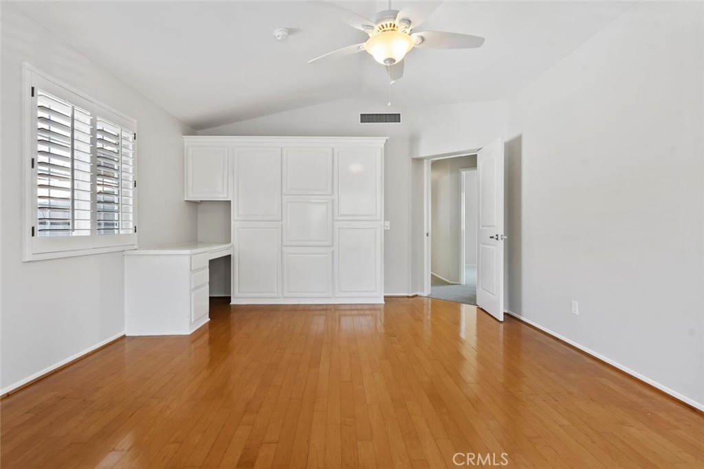5149 Pesto Way Oak Park, CA 91377 - Photo 35 of 42 a view of an empty room with a window and wooden floor