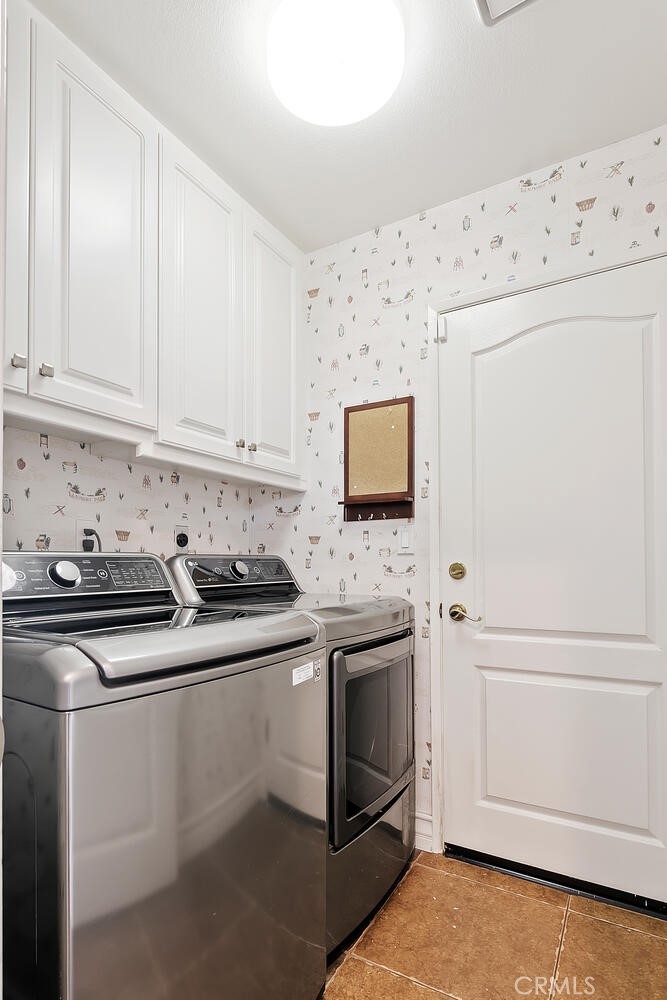 5149 Pesto Way Oak Park, CA 91377 - Photo 42 of 42 a kitchen with granite countertop white cabinets and white appliances