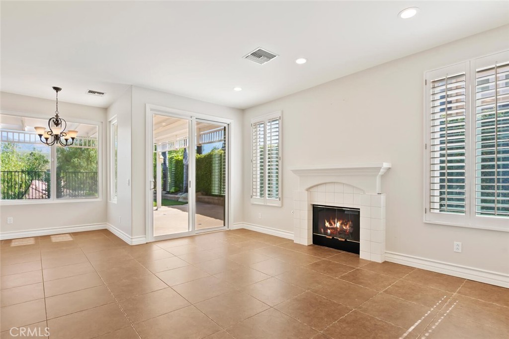 5149 Pesto Way Oak Park, CA 91377 - Photo 7 of 42 a view of an empty room with a fireplace and a window