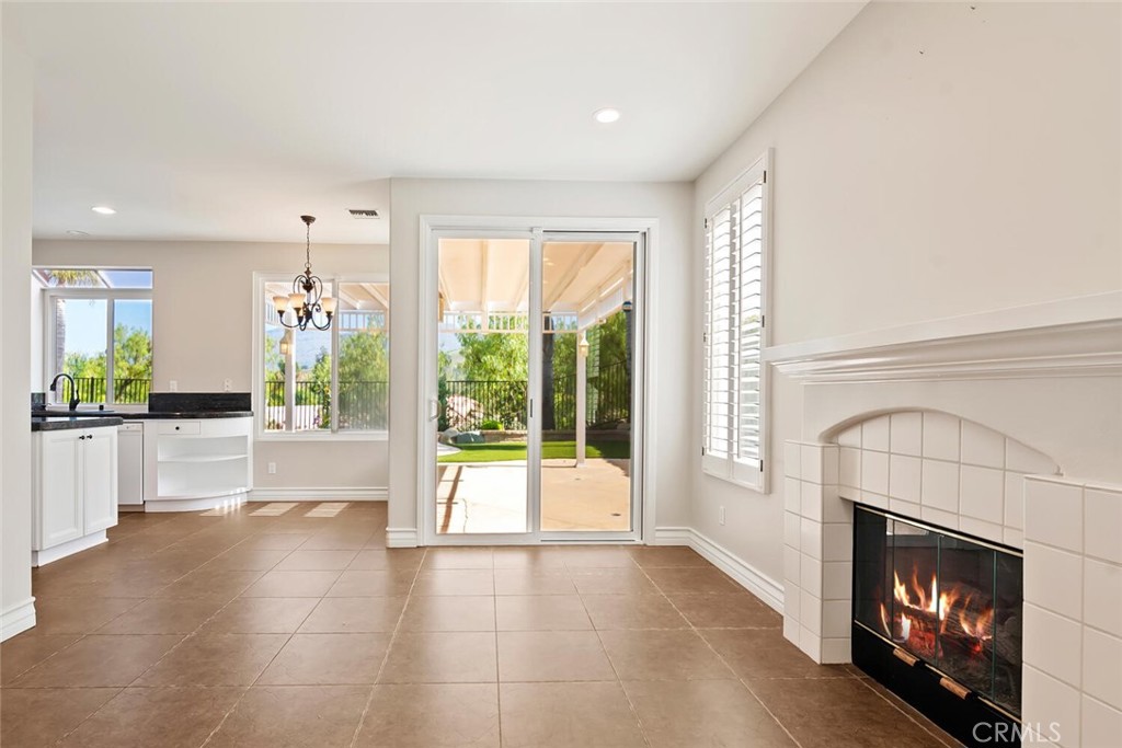 5149 Pesto Way Oak Park, CA 91377 - Photo 8 of 42 a view of an empty room with a fireplace and a window