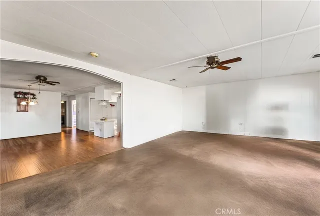 a view of a livingroom with a ceiling fan
