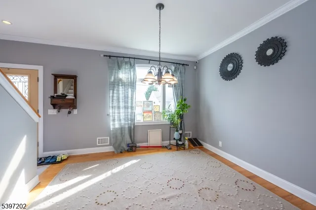 a view of room with window and ceiling fan