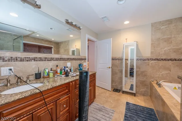 a kitchen with sink refrigerator and microwave