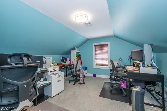 a view of a workspace with furniture