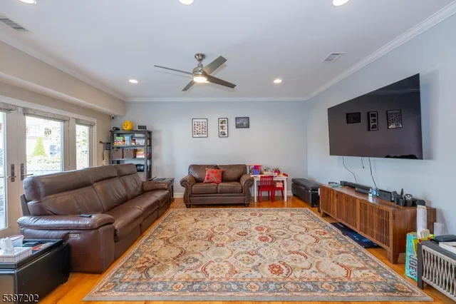 a view of a house with backyard and trees