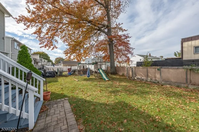 a view of a house with backyard porch and sitting area