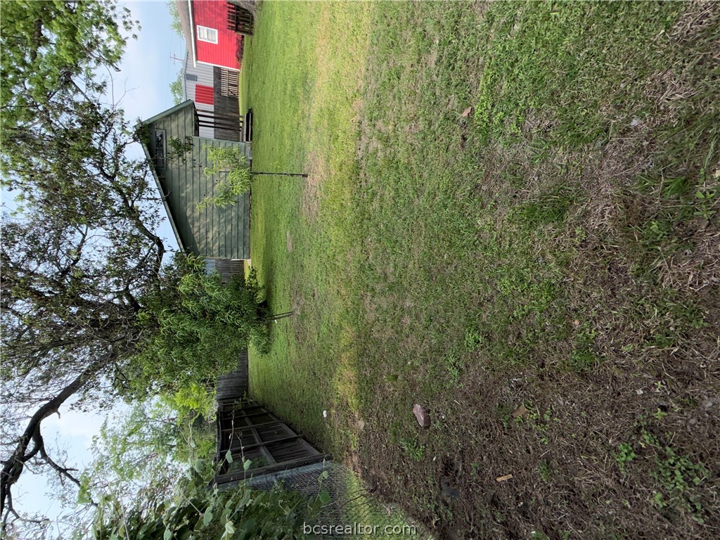 421 South Commerce Street Centerville, TX 75833 - Photo 22 of 23 a backyard of a house with lots of green space