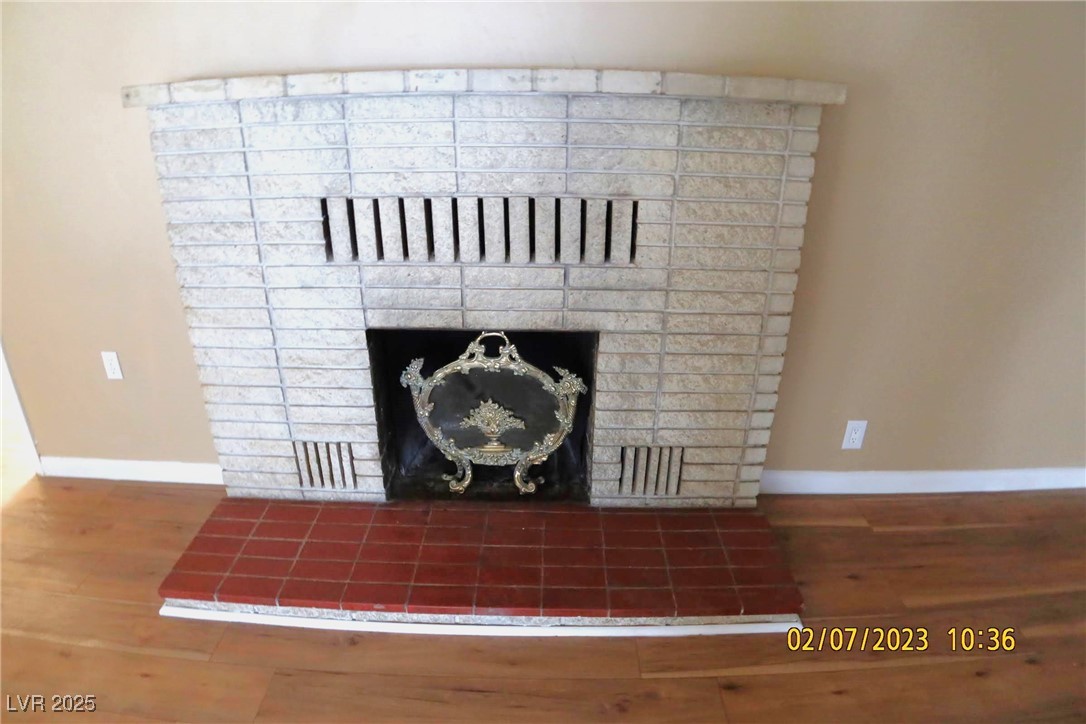 10 East Bonanza Road Las Vegas, NV 89101 - Photo 12 of 35 Interior details with baseboards, wood finished floors, and a fireplace