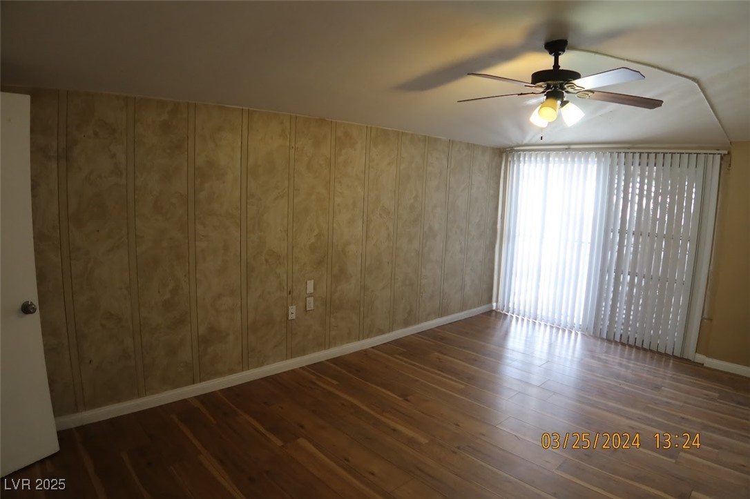 10 East Bonanza Road Las Vegas, NV 89101 - Photo 4 of 35 Unfurnished room featuring baseboards, a ceiling fan, and hardwood / wood-style flooring