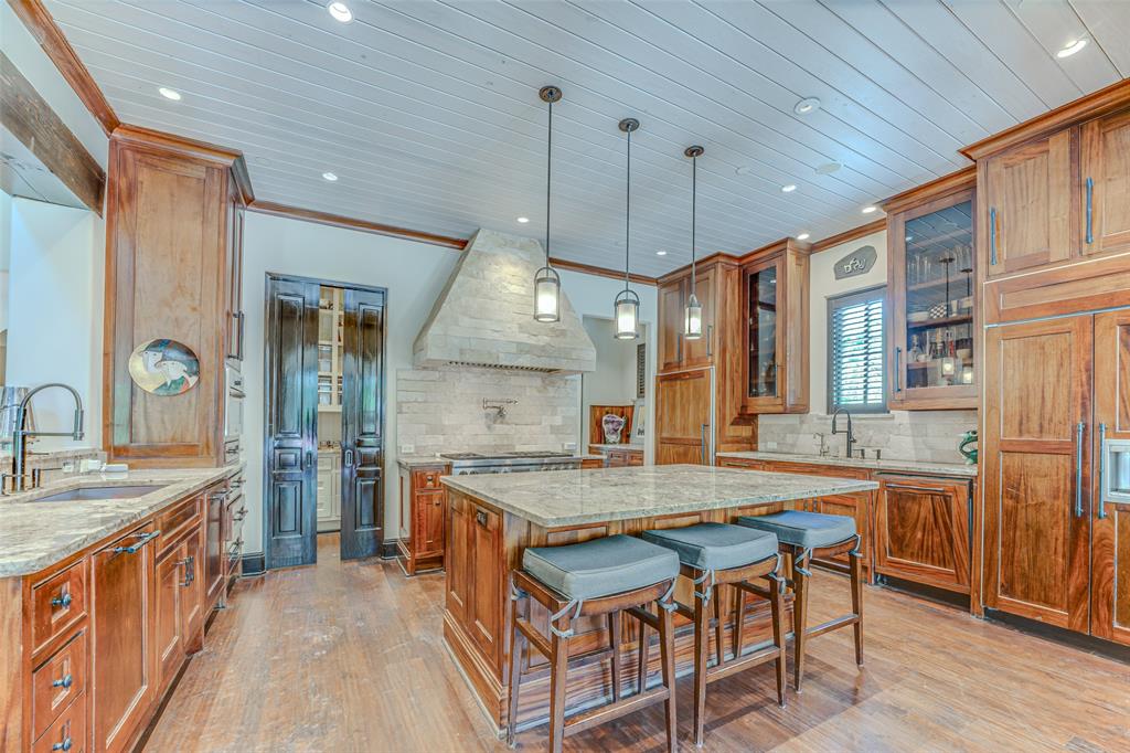 4120 Cochran Chapel Road Dallas, TX 75220 - Photo 12 of 39 a kitchen with stainless steel appliances granite countertop a kitchen island a stove and a sink