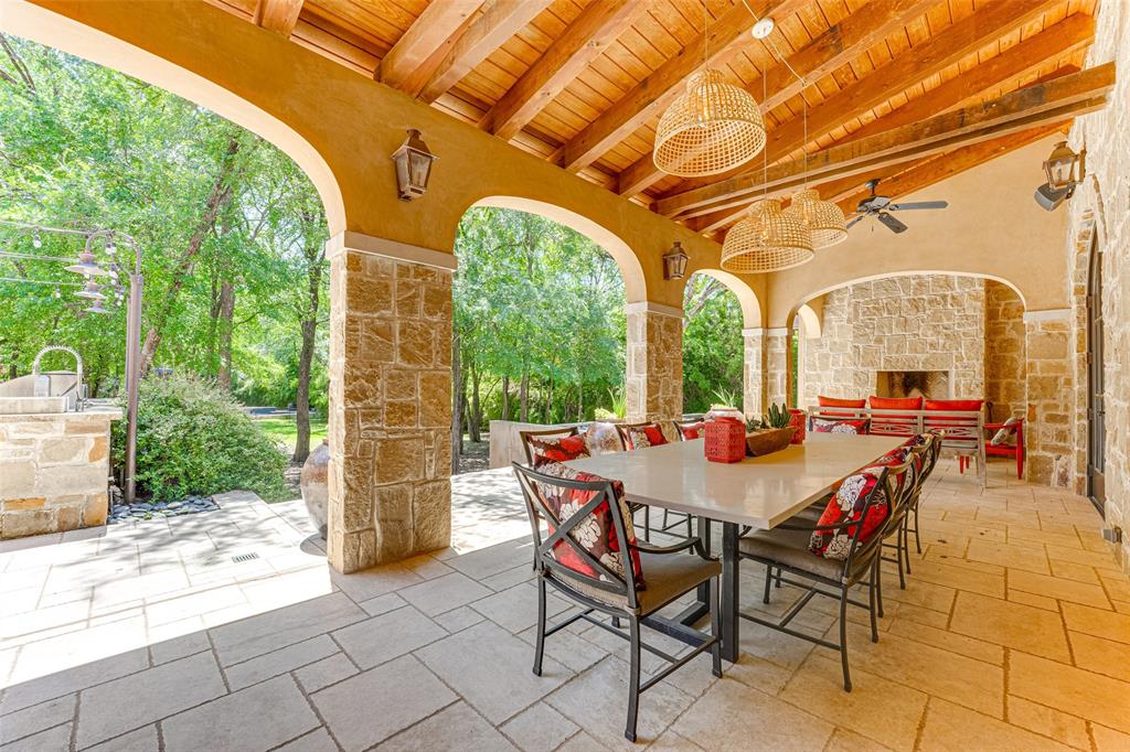 4120 Cochran Chapel Road Dallas, TX 75220 - Photo 26 of 39 a view of a patio with a table and chairs