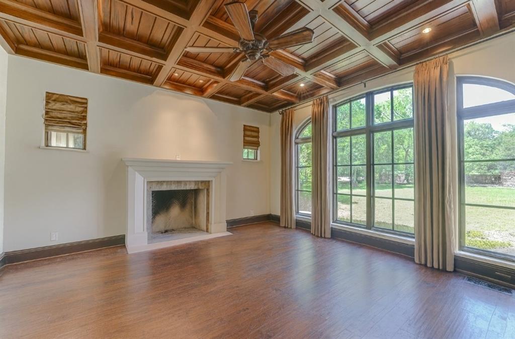 4120 Cochran Chapel Road Dallas, TX 75220 - Photo 7 of 39 a view of an empty room with wooden floor and a window