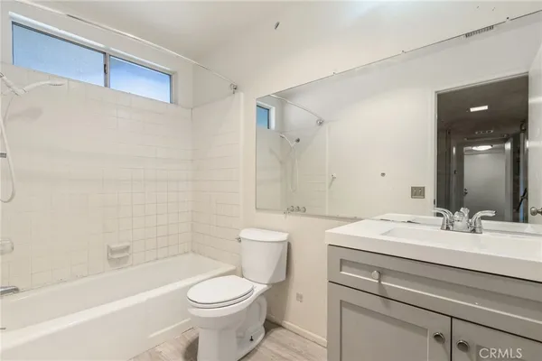 a bathroom with a sink a toilet and a bathtub