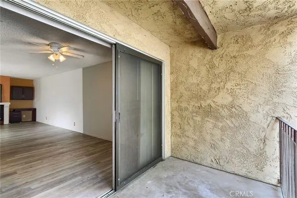 a view of livingroom with hardwood floor and ceiling fan