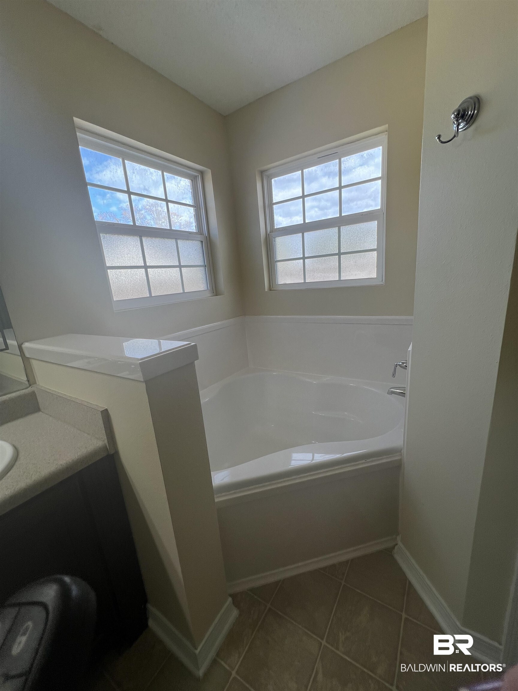 17793 Fancy Boulevard Foley, AL 36535 - Photo 17 of 34 Bathroom featuring tile patterned flooring, vanity, and a tub